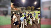Brewers manager Pat Murphy helps coach Wisconsin youth baseball