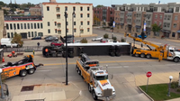 Semi-truck flips on its side in downtown Racine, driver extricated
