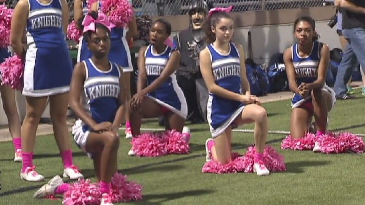 McCallum HS cheerleaders take a knee at game