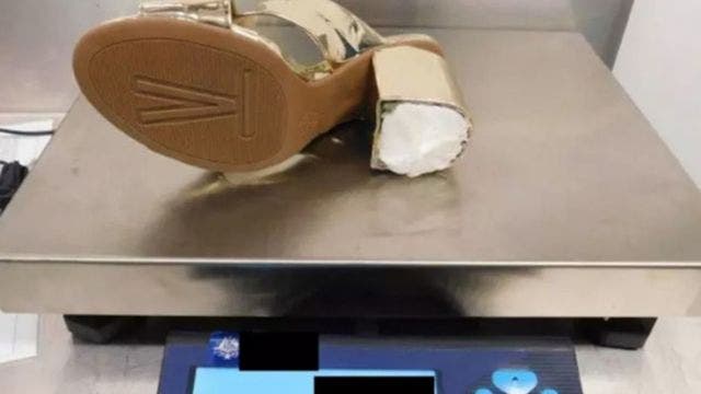 Woman busted at airport for smuggling cocaine inside high heels, officials say