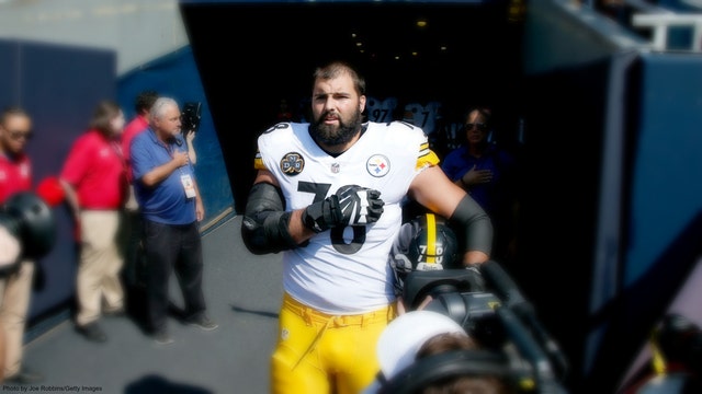 Pittsburgh Steeler stands alone for national anthem