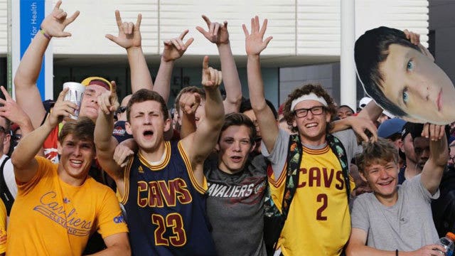 Massive crowd swarms Cleveland for Cavs' NBA title parade