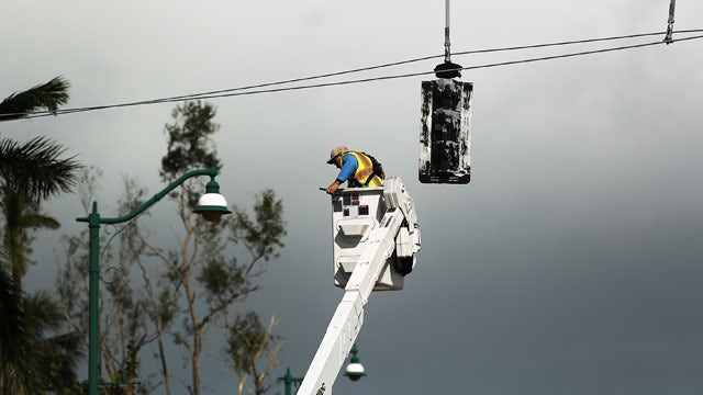 Without air conditioning, steamy Florida yearns for power