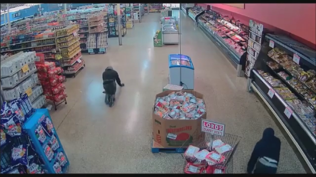Video: burglars crawl through grocery store