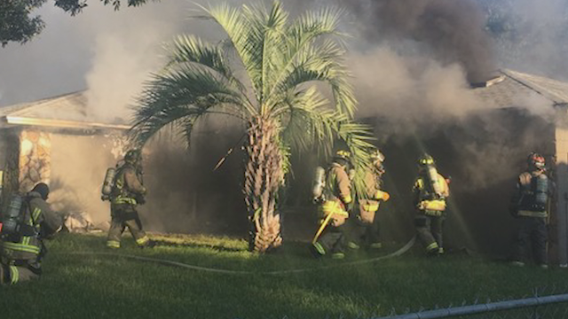 Officials: Woman set fire to home during breakup