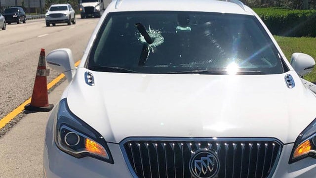 Metal rod falls from truck, narrowly misses Miami driver