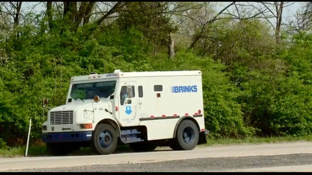 Brinks truck drops thousands of dollars on Indiana highway