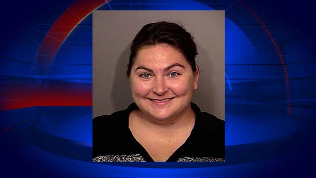 Florida official charged with living in dead woman's home