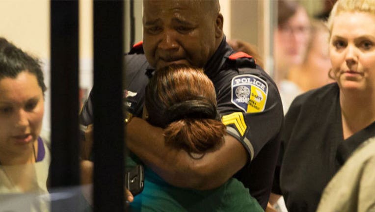 Dallas-officer-hugs-civilian_1468017507202.jpg
