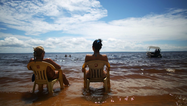 GETTY Stock image of beach, women sunbathing, hot day, hot weather-404023
