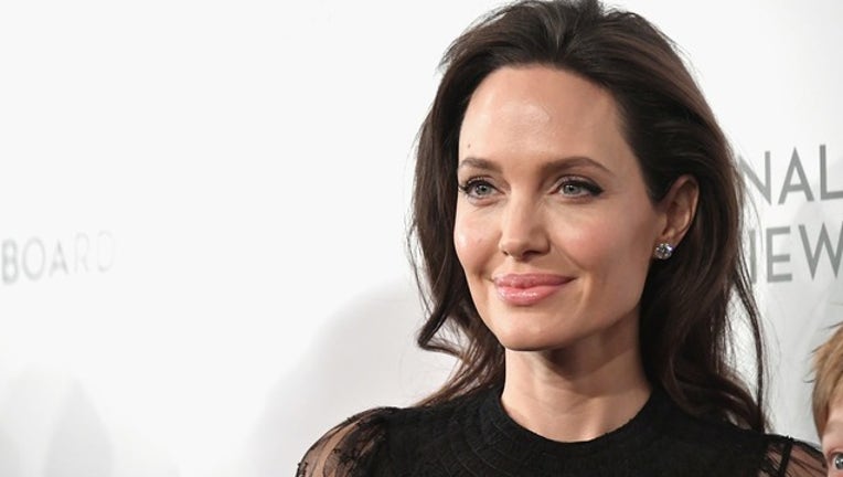 56d4cafb-GETTY_angelina jolie_123018_1546180703680.png-402429.jpg