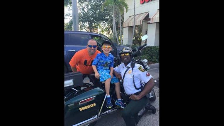 Little boy Buys Officer Breakfast_1442192769450-401096.jpg