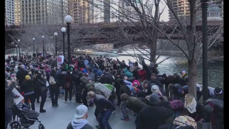 75cb0dc7-Hundreds of people dropped their pants and mooned the Trump Tower in Chicago Sunday (Photo Fresco News Katy Schlake)-404023