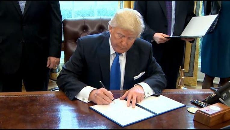 Trump Signing_1485370448384-401096.JPG