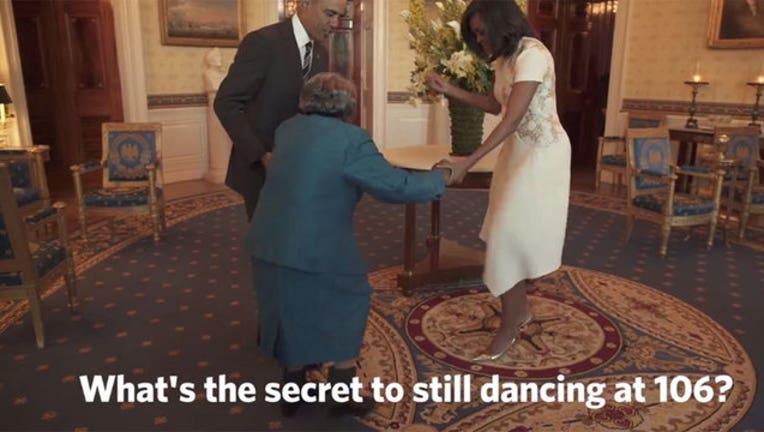 Woman Dances With Obamas-402970