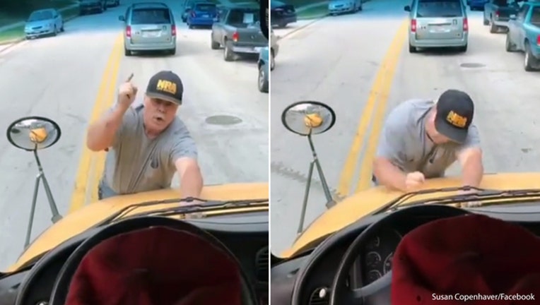 7dd68cb8-Angry Baltimore County man clings to school bus-401720