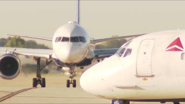 9967c5ab-waga atlanta airport delta plane taxiway side and front_1558986812627.JPG-404959.jpg
