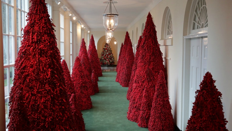 9dc6fb4a-white house christmas red trees_1545518944425.jpg-401720.jpg