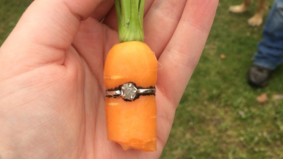 Danielle “Deejay” Squires holds her engagement ring wrapped around a carrot from her backyard. (Photo credit: Danielle