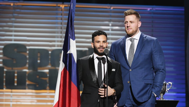 NEW YORK, NY - DECEMBER 05: J.J. Watt (R) and Jose Altuve receive the Sportsperson of the Year Award during SPORTS ILLUSTRATED 2017 Sportsperson of the Year Show on December 5, 2017 at Barclays Center in New York City.