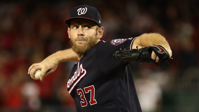 WASHINGTON, DC - OCTOBER 14: Stephen Strasburg #37 of the Washington Nationals pitches in the seventh inning of the game three of the National League Championship Series against the Washington Nationals at Nationals Park on October 14, 2019 in Washington, DC. (Photo by Patrick Smith/Getty Images)