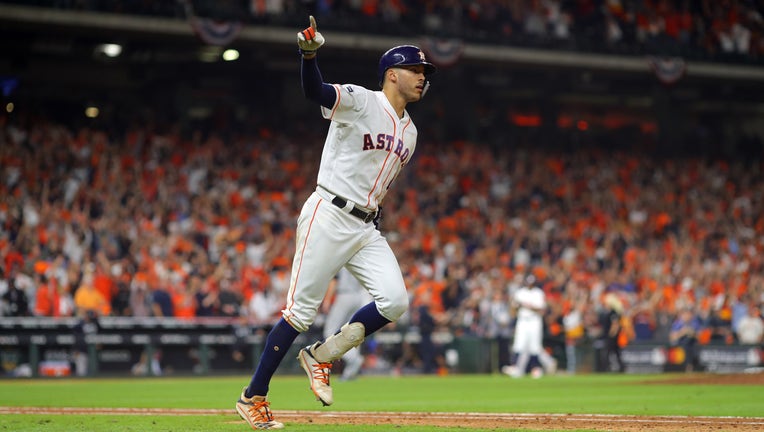 HOUSTON, TX - OCTOBER 13: Carlos Correa #1 of the Houston Astros rounds the bases after hitting a walk off home run in the 11th inning to beat the New York Yankees in Game 2 of the ALCS at Minute Maid Park on Sunday, October 13, 2019 in Houston, Texas.
