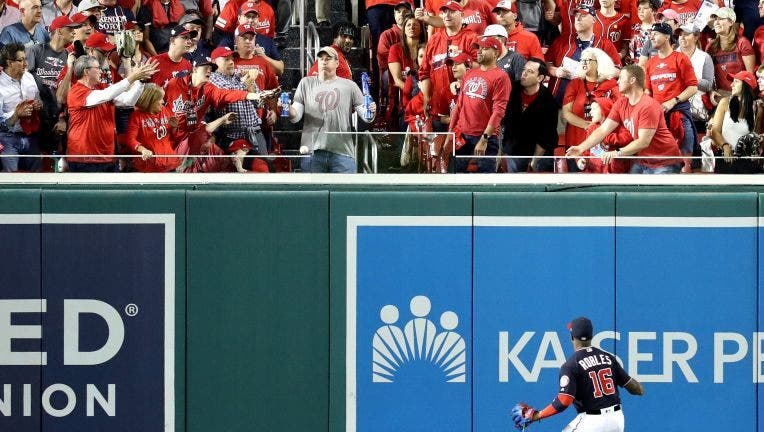 WASHINGTON, DC - OCTOBER 27: Victor Robles #16 of the Washington Nationals watches a two-run home run hit by Yordan Alvarez (not pictured) of the Houston Astros leave the park during the second inning in Game Five of the 2019 World Series at Nationals Park on October 27, 2019 in Washington, DC.