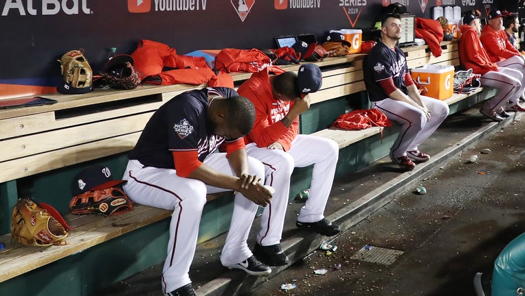 The Washington Nationals react against the Houston Astros during the ninth inning in Game Five of the 2019 World Series