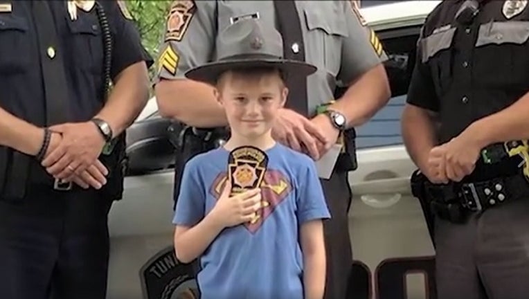 d12a1095-PA troopers surprise boy raising money for neighbors_1498592578810-401096.jpg