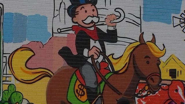 Alec "Monopoly" brings new mural to Downtown Austin