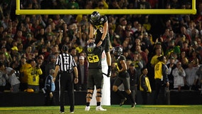 Herbert has 3 TD runs, Oregon beats Wisconsin in Rose Bowl