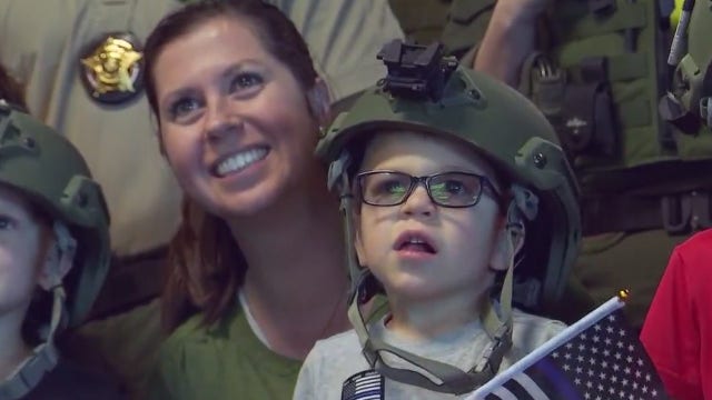 Georgetown boy at center of dismissed swing set lawsuit becomes honorary Wilco deputy, SWAT team member