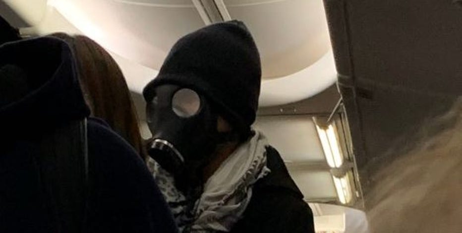 Man Wearing Gas Mask On Plane Starts Panic Has To Be Escorted Off Flight