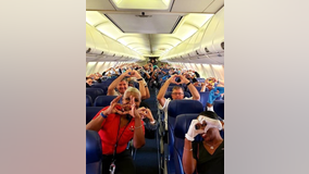 Viral photos show health care workers on plane, en route to New York to help in coronavirus fight