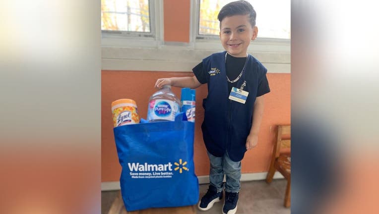 Little boy dresses as Walmart clerk