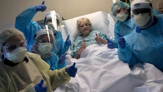 Hospital staff celebrate 98-year-old woman's 'triumphant win' over COVID-19