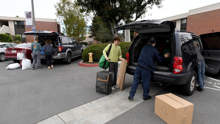 CSULB students move out of dorms as school closure is extended through end of semester.
