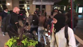 Weapon-wielding man left badly beaten by gang amid Dallas protests