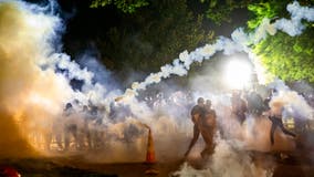 Protesters start fires near the White House, police fire tear gas into crowd