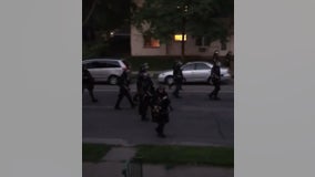 Video: Law enforcement fires paint projectile at residents on porch during curfew in Minneapolis