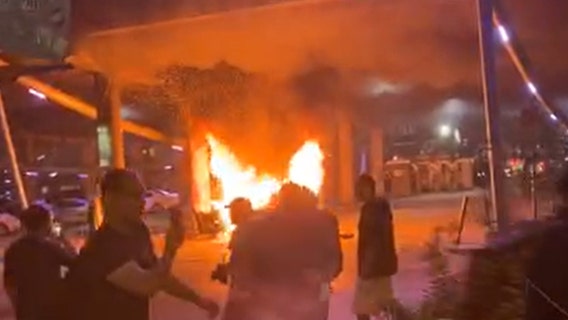 Car, mattress, and dumpster set on fire at George Floyd protest in downtown Austin