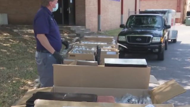 Austin ISD seniors pick up caps and gowns ready for virtual, in-person graduations
