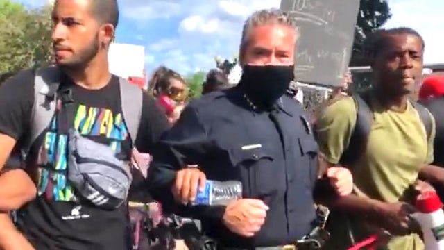 Video shows Denver police chief marching arm-in-arm with protesters at George Floyd demonstration