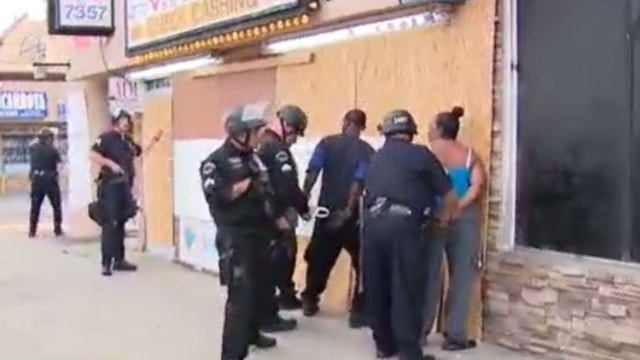 Good Samaritans detained on live TV while protecting LA business from alleged looters