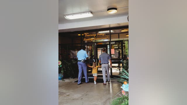 Georgia troopers walk daughter of fallen comrade to first day of school