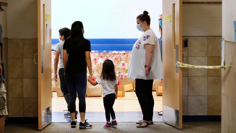 36893707-Students Pick Up Personal Belongings As Teachers Clean Out Classrooms At End Of Pandemic-Impacted School Year