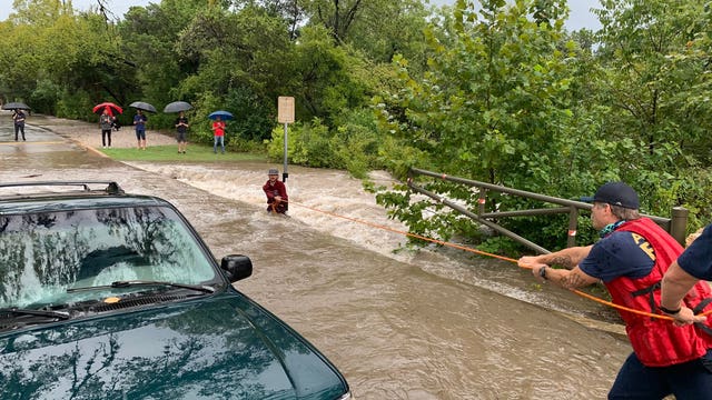 AFD rescues bystander nearly swept away while trying to help stranded motorist