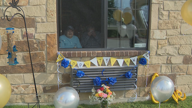 Family holds parade for North Texas couple in nursing home to celebrate their 75th anniversary