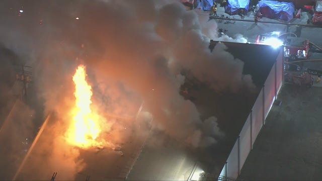 Crews battle large fire at DTLA commercial building, 1 firefighter hurt