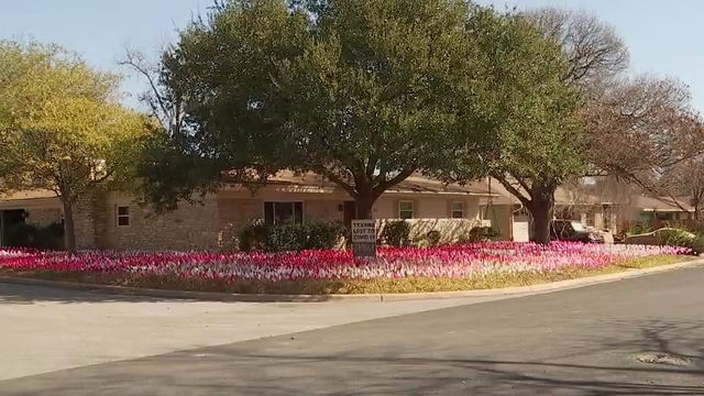 Austin artist prepares to take down COVID-19 memorial flags in yard